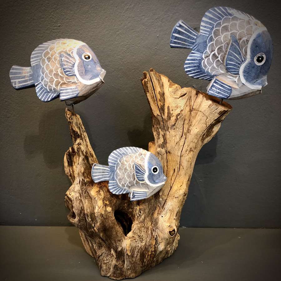 Carved fish on a wooden reef